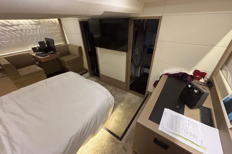  Yacht Photos Pics Luxurious interior of a 2018 Prestige 560 yacht with modern furnishings and cozy seating area.