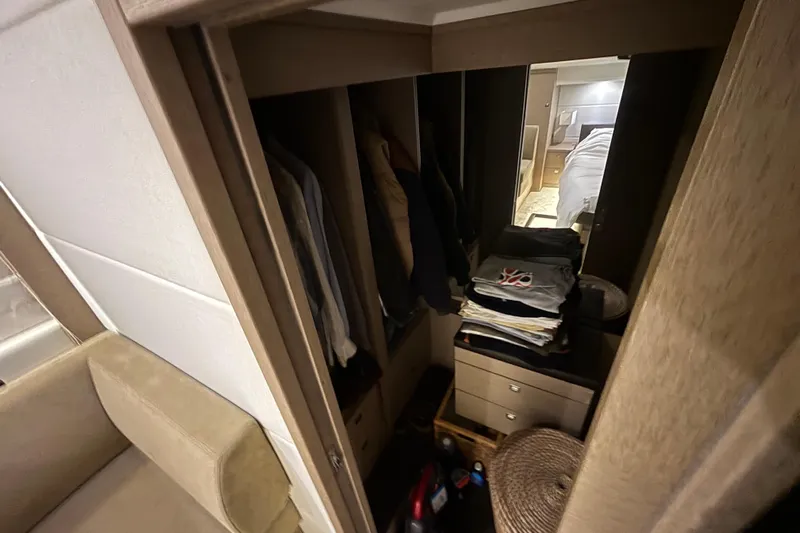  Yacht Photos Pics Interior of 2018 Prestige 560 yacht showing closet and bedroom area.