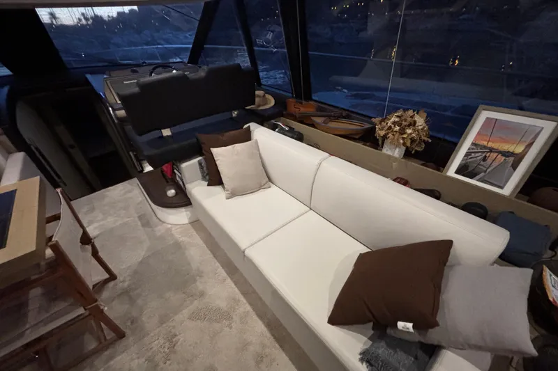  Yacht Photos Pics Luxurious interior of 2018 Prestige 560 yacht with elegant seating and decor.