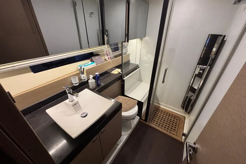  Yacht Photos Pics Luxurious bathroom in 2018 Prestige 560 yacht with modern fixtures and elegant design.