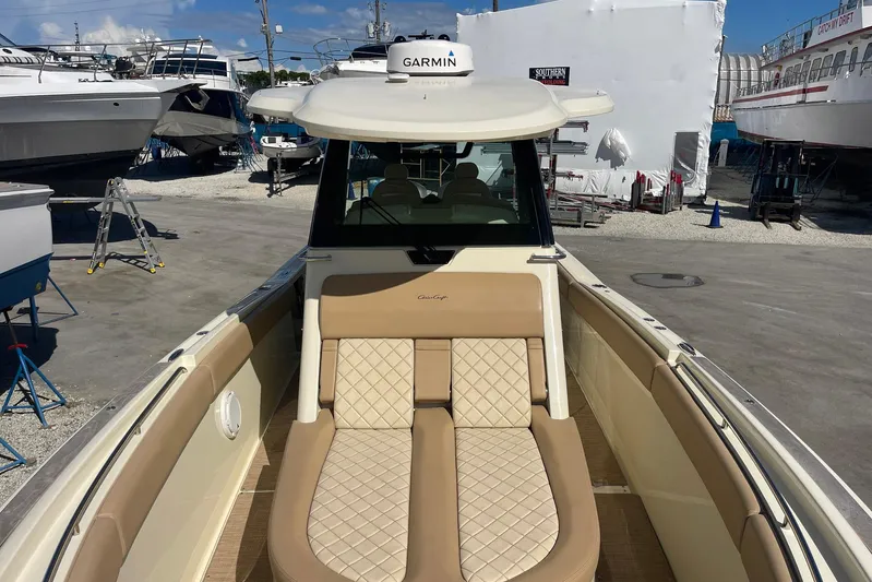  Yacht Photos Pics 2020 Chris-Craft Catalina 30 boat with tan seating, docked in a marina.