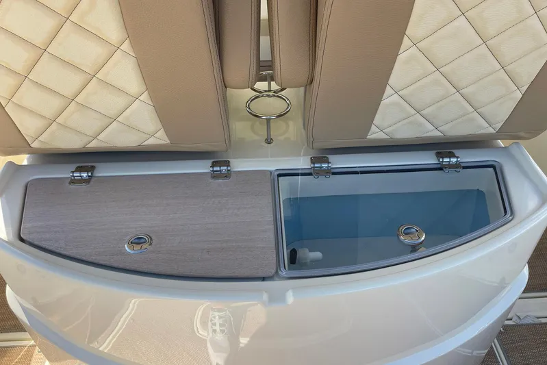  Yacht Photos Pics 2020 Chris-Craft Catalina 30 boat seating with storage compartments, featuring elegant quilted upholstery.