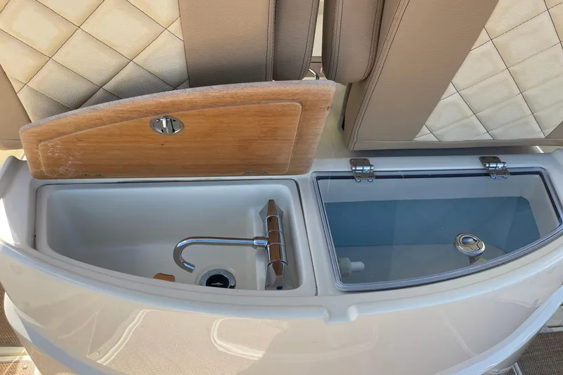  Yacht Photos Pics 2020 Chris-Craft Catalina 30 boat interior with sink and storage compartments.