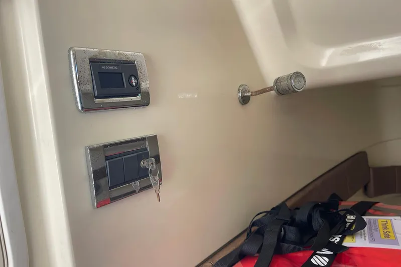  Yacht Photos Pics 2020 Chris-Craft Catalina 30 interior with control panel and safety equipment.