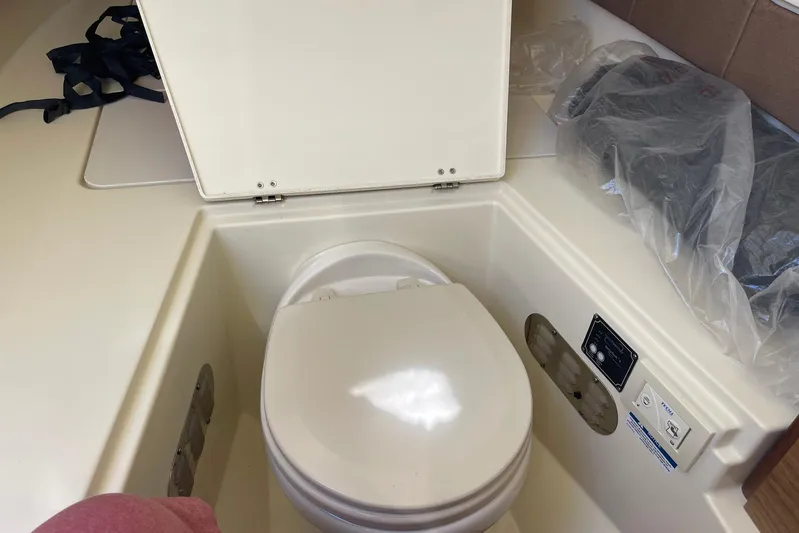  Yacht Photos Pics 2020 Chris-Craft Catalina 30 boat interior with compact marine toilet.