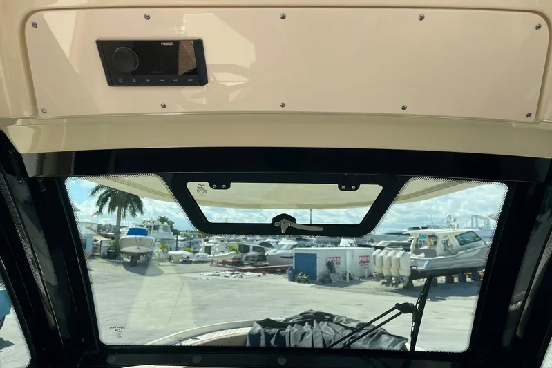  Yacht Photos Pics Interior view of 2020 Chris-Craft Catalina 30 boat with marina background.