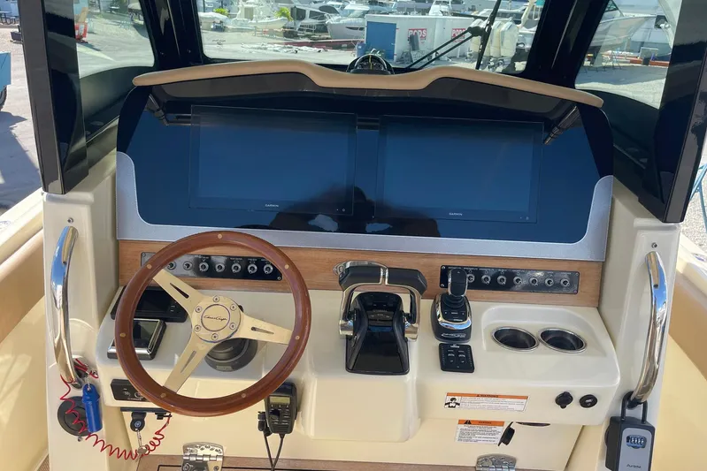  Yacht Photos Pics 2020 Chris-Craft Catalina 30 helm with steering wheel, controls, and dual displays.