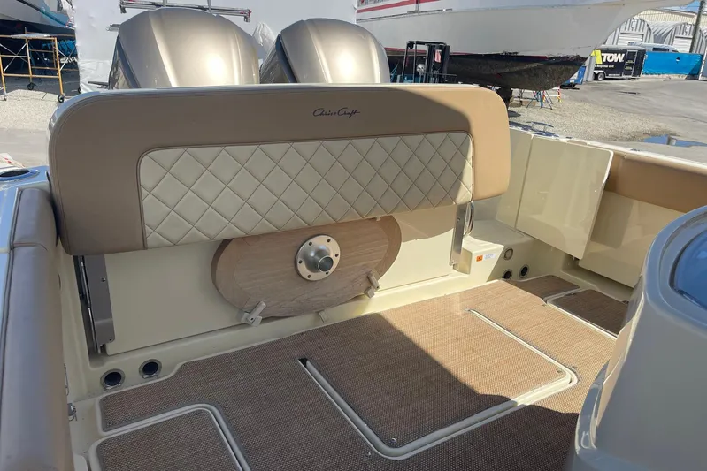  Yacht Photos Pics 2020 Chris-Craft Catalina 30 boat interior with cushioned seating and dual engines.