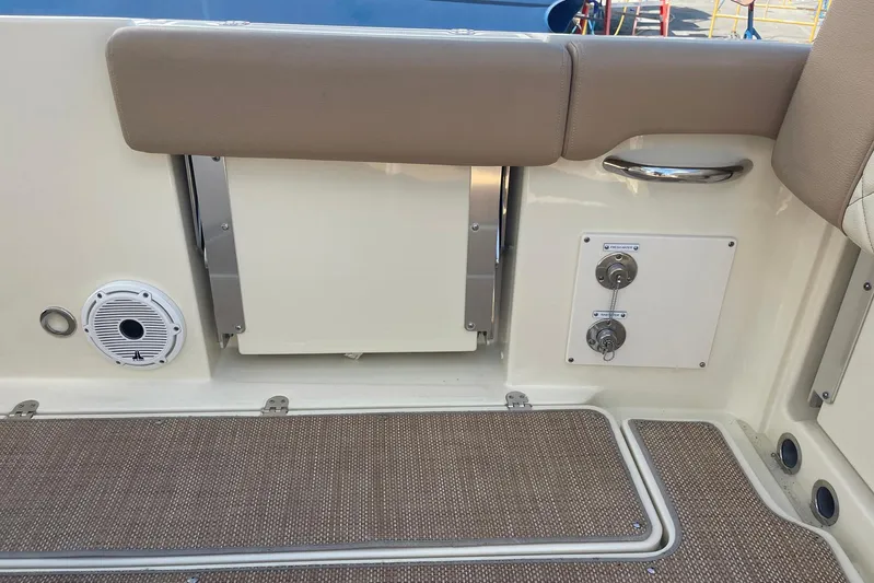  Yacht Photos Pics Interior view of a 2020 Chris-Craft Catalina 30 boat, featuring seating and control panel.