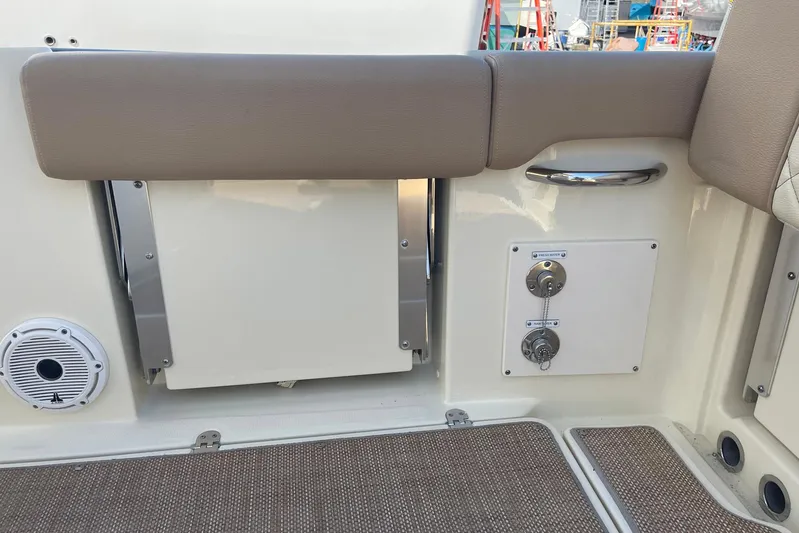  Yacht Photos Pics 2020 Chris-Craft Catalina 30 interior with seating, speaker, and control panel.