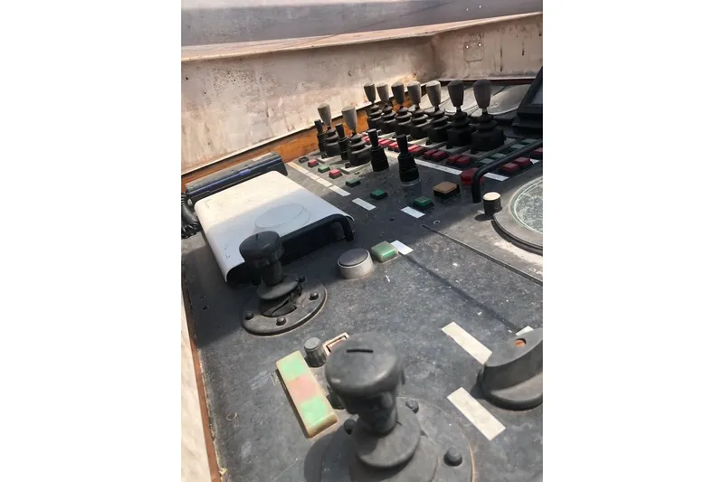  Yacht Photos Pics Control panel of 2001 Ortona Navi 115 yacht with various switches and levers.