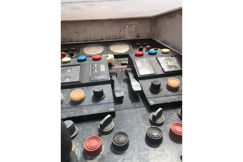  Yacht Photos Pics Control panel of a 2001 Ortona Navi 115 yacht with various buttons and switches.