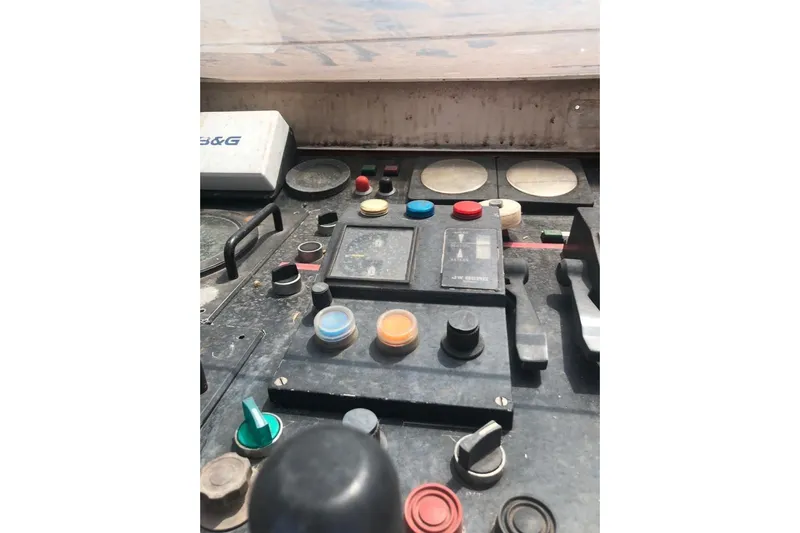  Yacht Photos Pics Control panel of a 2001 Ortona Navi 115 yacht with various buttons and switches.