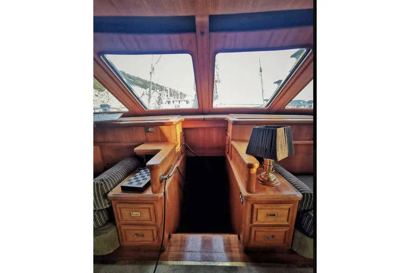  Yacht Photos Pics Luxurious wooden interior of 2001 Ortona Navi 115 yacht with elegant furnishings.