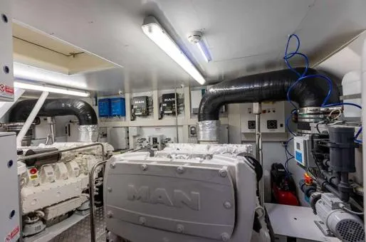  Yacht Photos Pics Engine room of 2016 Custom Line Navetta 28 yacht, featuring MAN engines and modern equipment.