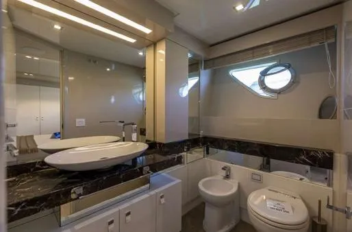  Yacht Photos Pics Luxurious bathroom on 2016 Custom Line Navetta 28 yacht with modern fixtures and elegant design.