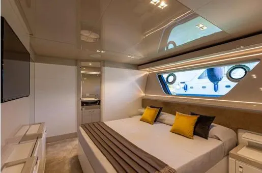  Yacht Photos Pics Luxurious bedroom interior on 2016 Custom Line Navetta 28 yacht with modern decor and large window.
