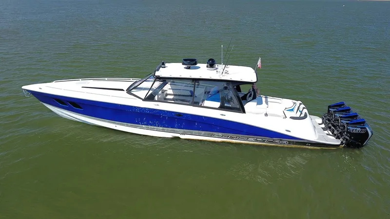 Blueprint Yacht Photos Pics 2020 Concept 44' Cuddy Cabin boat with blue and white design on calm water.