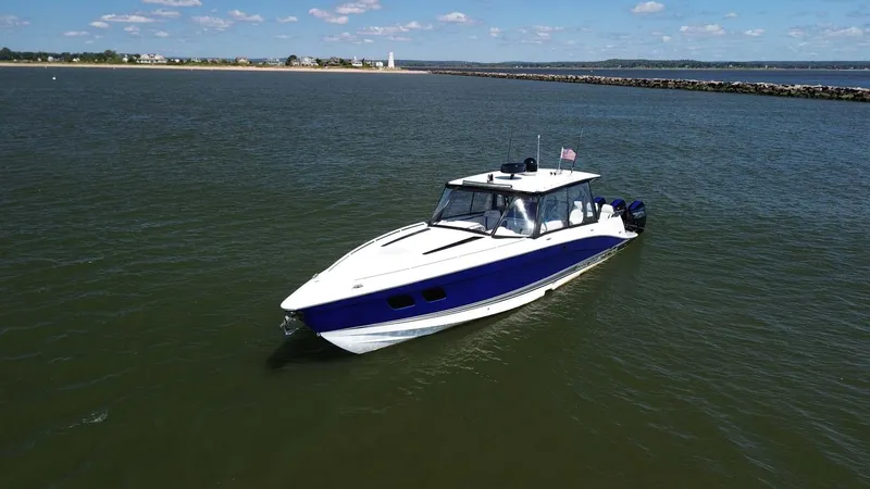 Blueprint Yacht Photos Pics 2020 Concept 44' Cuddy Cabin boat on calm water, clear sky background.