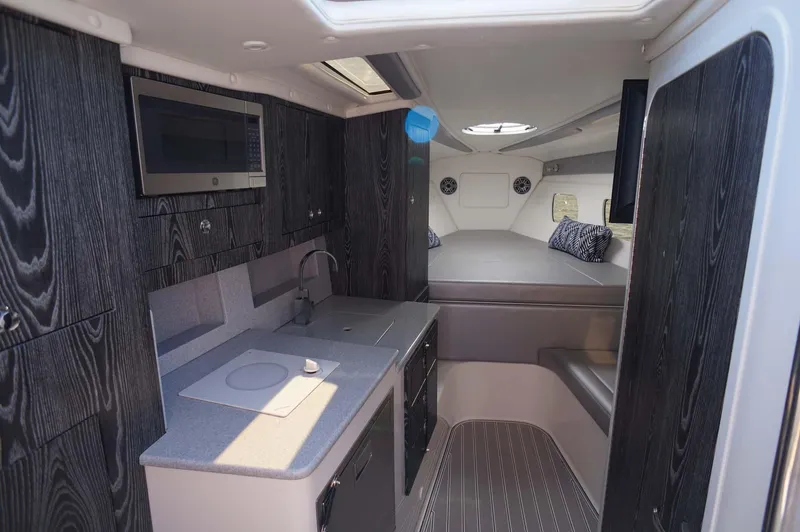 Blueprint Yacht Photos Pics 2020 Concept 44' Cuddy Cabin interior with modern kitchen and cozy sleeping area.