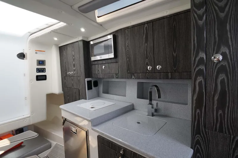 Blueprint Yacht Photos Pics Modern kitchen in 2020 Concept 44' Cuddy Cabin boat with sleek cabinetry and appliances.