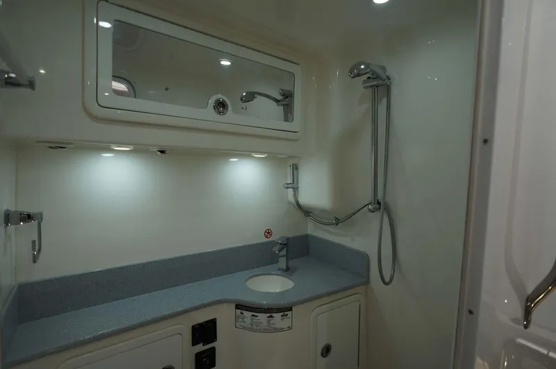 Blueprint Yacht Photos Pics Modern bathroom in 2020 Concept 44' Cuddy Cabin boat with shower and sink.