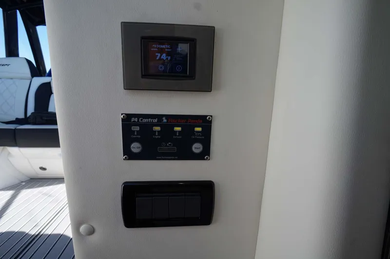 Blueprint Yacht Photos Pics Control panel inside 2020 Concept 44' Cuddy Cabin boat, featuring digital and manual controls.