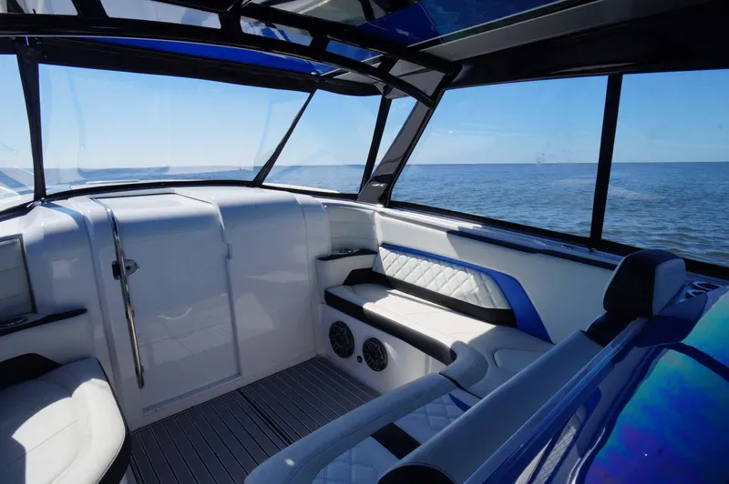 Blueprint Yacht Photos Pics 2020 Concept 44' Cuddy Cabin interior with ocean view, featuring sleek seating and modern design.