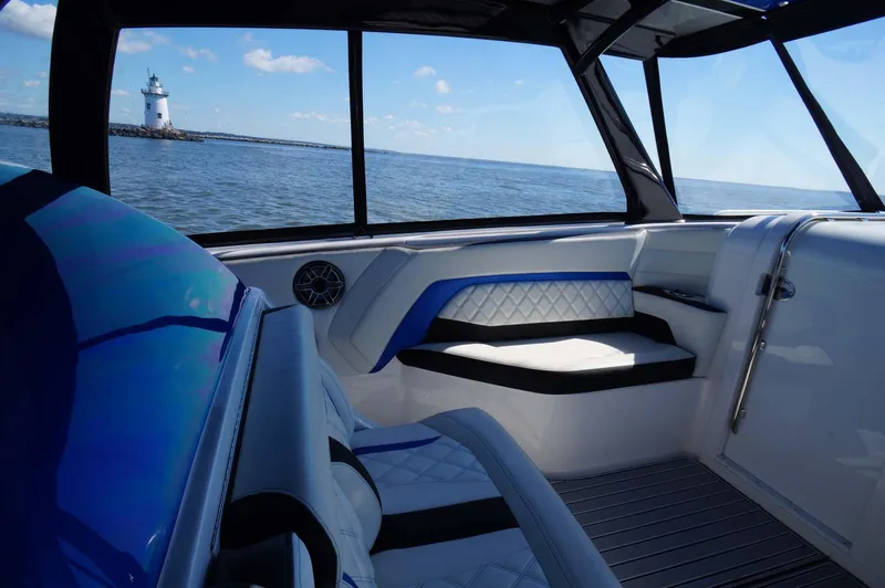 Blueprint Yacht Photos Pics Interior of 2020 Concept 44' Cuddy Cabin boat with ocean view and lighthouse.