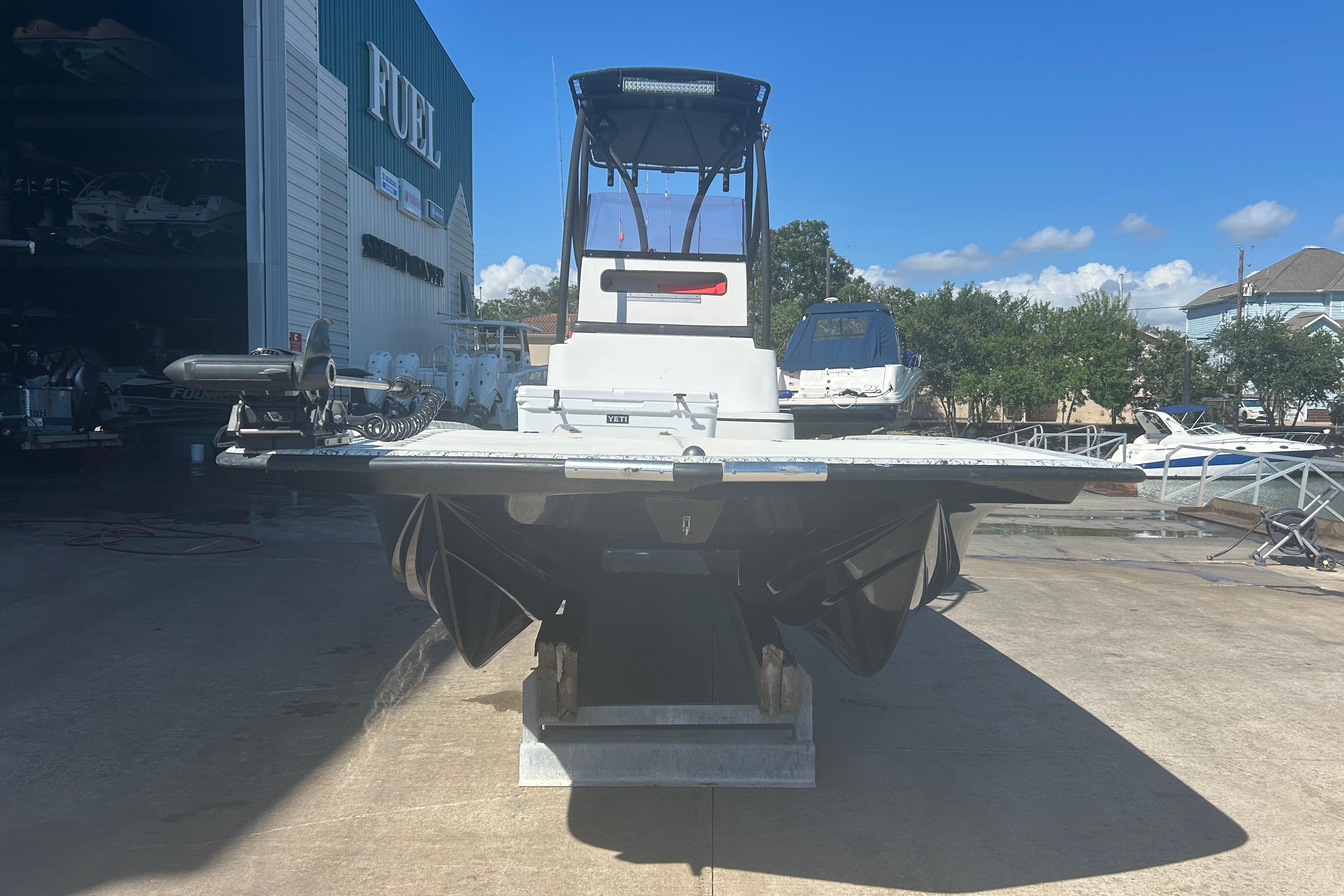 2020 Dargel Kat 250 HDX boat on a dock, with a clear blue sky background.