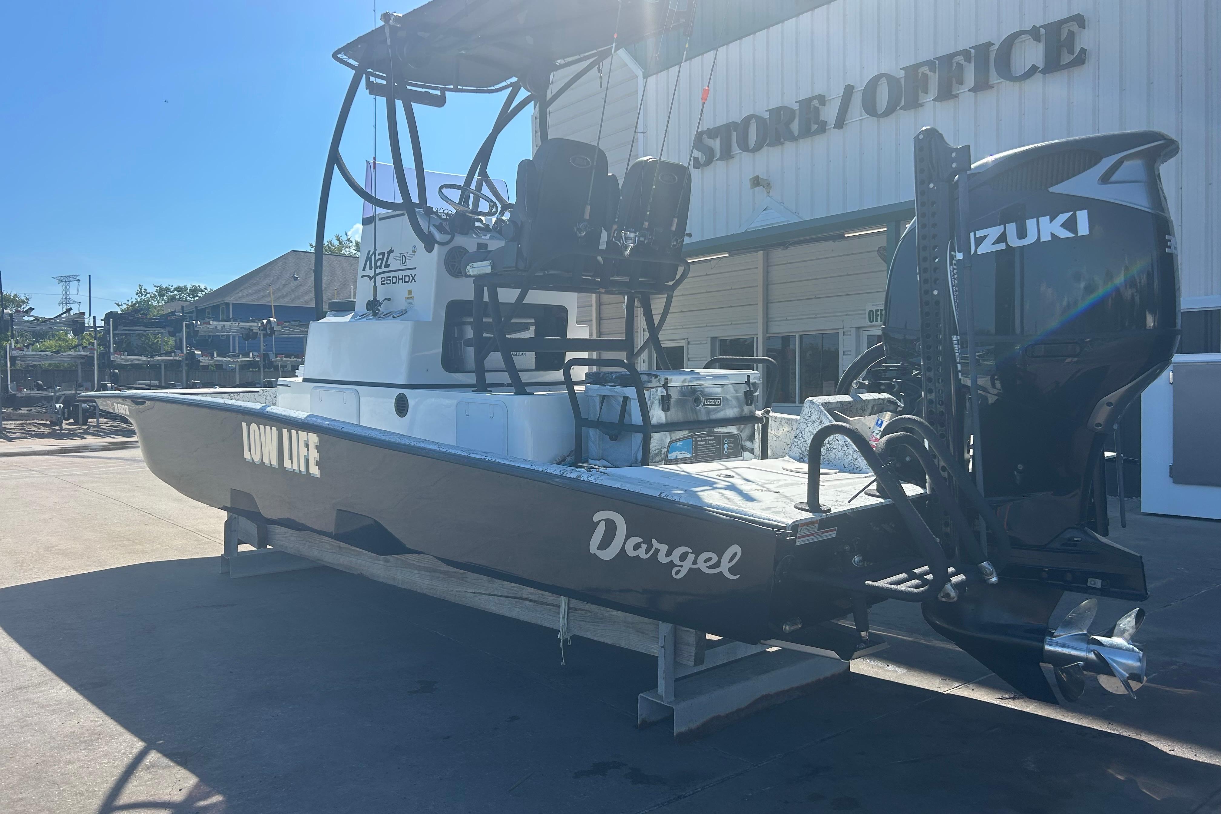 2020 Dargel Kat 250 HDX boat with Suzuki engine at a store office.