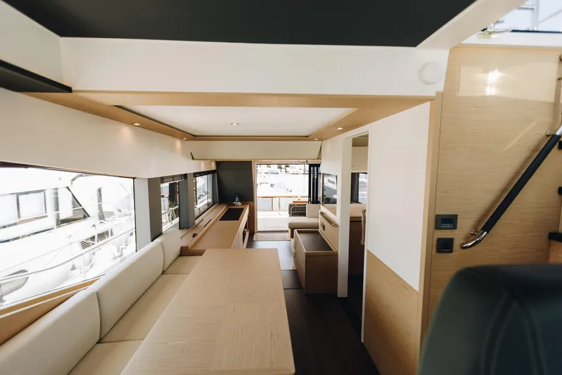  Yacht Photos Pics Luxurious interior of 2024 Beneteau Grand Trawler 62 yacht, featuring modern design and spacious layout.