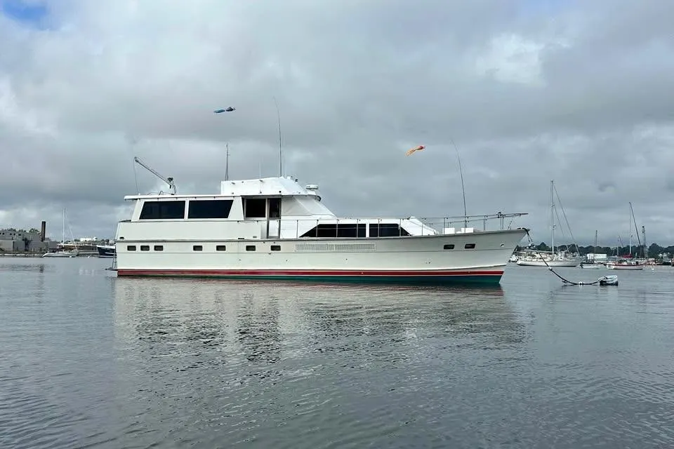 1975 Pacemaker 62 Motor Yacht on calm water under cloudy sky.