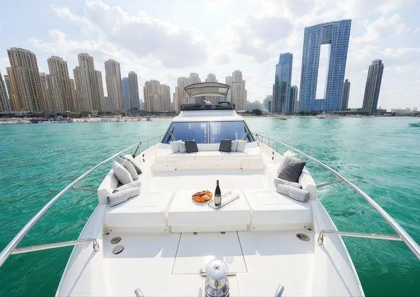  Yacht Photos Pics Luxurious 2019 Ferretti Yachts 670 cruising with city skyline backdrop.