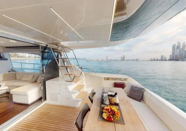  Yacht Photos Pics Luxurious 2019 Ferretti Yachts 670 with elegant deck, dining area, and stunning ocean view.