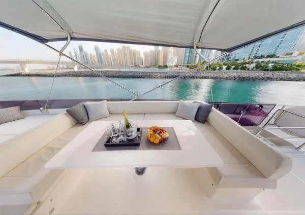  Yacht Photos Pics Luxurious 2019 Ferretti Yachts 670 with elegant seating and city skyline view.