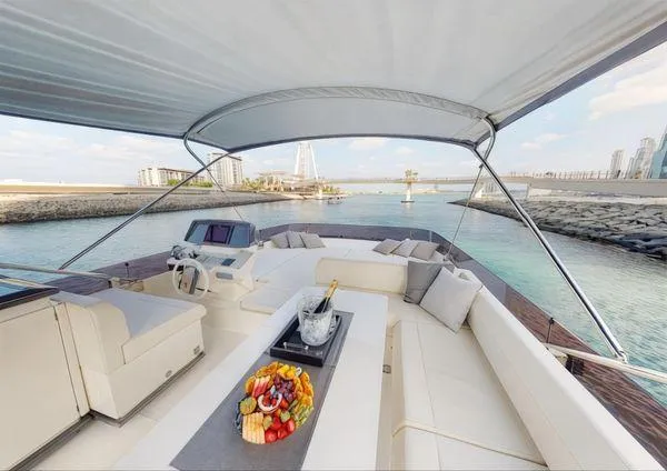  Yacht Photos Pics Luxurious 2019 Ferretti Yachts 670 with spacious deck, fruit platter, and scenic waterfront view.