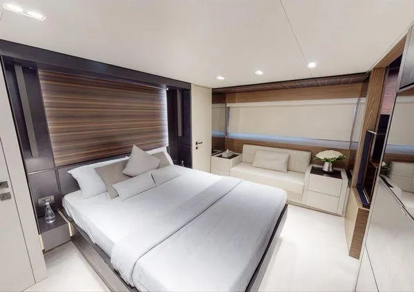  Yacht Photos Pics Luxurious bedroom interior of 2019 Ferretti Yachts 670 with modern design and elegant furnishings.