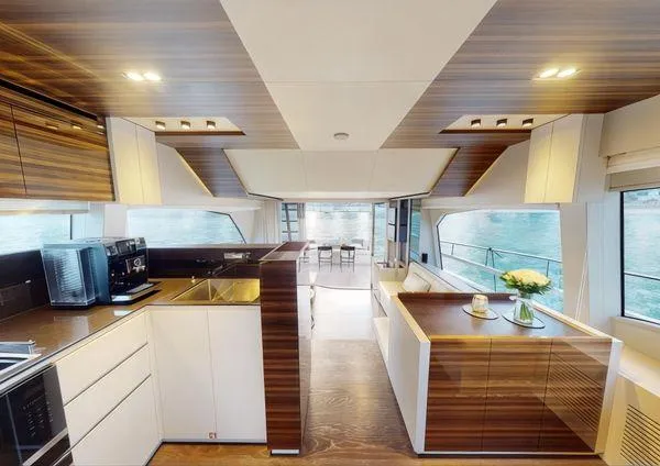  Yacht Photos Pics Luxurious interior of 2019 Ferretti Yachts 670 with modern kitchen and elegant design.