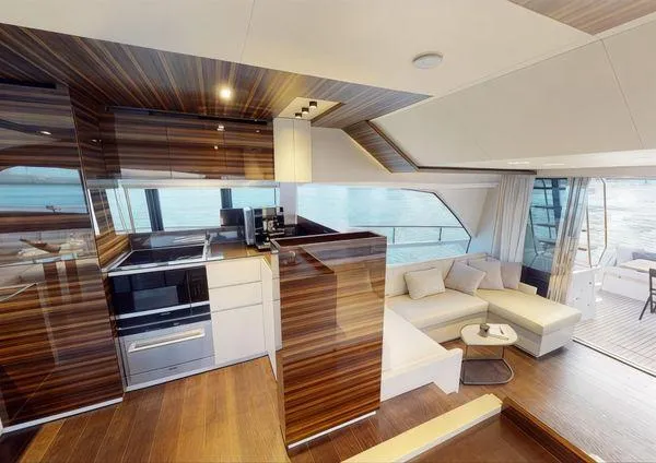  Yacht Photos Pics Luxurious interior of 2019 Ferretti Yachts 670 with modern kitchen and seating area.