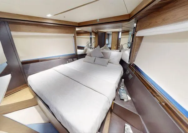  Yacht Photos Pics Luxurious bedroom interior of 2019 Ferretti Yachts 670 with modern design and elegant furnishings.