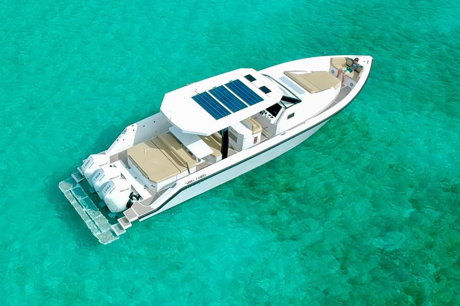 2025 Impulse 43 S boat with solar panels on turquoise water.