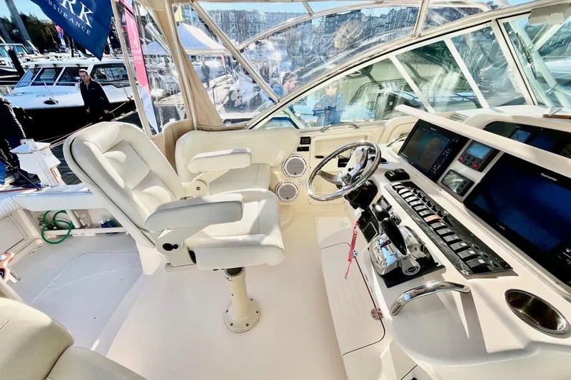  Yacht Photos Pics Helm of 2005 Grady-White Express 360 boat with modern controls and seating.