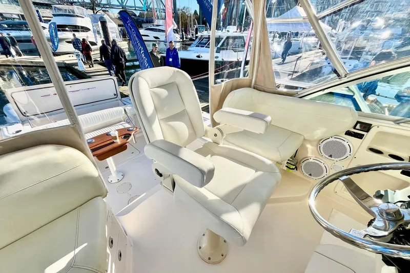  Yacht Photos Pics Interior of 2005 Grady-White Express 360 boat with plush seating and steering wheel.