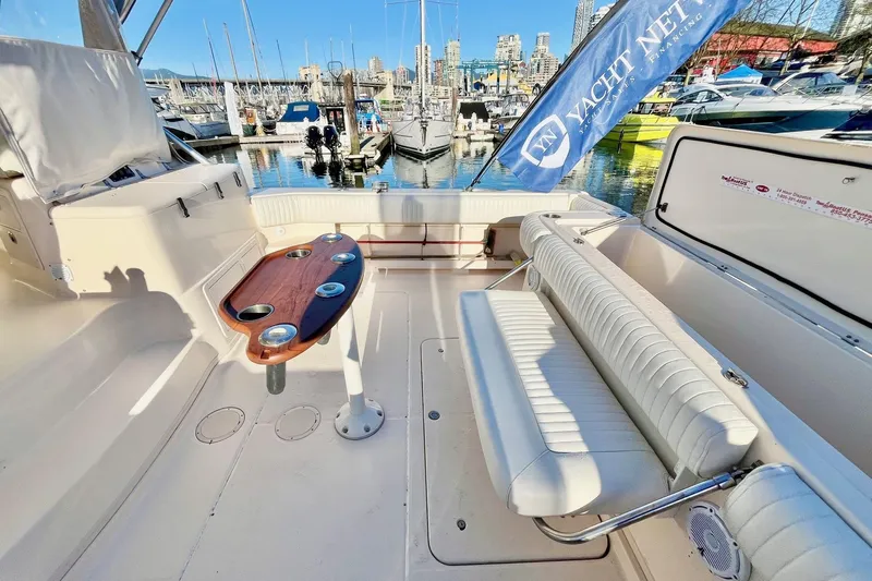  Yacht Photos Pics 2005 Grady-White Express 360 boat interior with seating and table at marina.