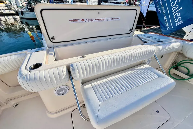  Yacht Photos Pics 2005 Grady-White Express 360 boat with open storage compartment and cushioned seating.