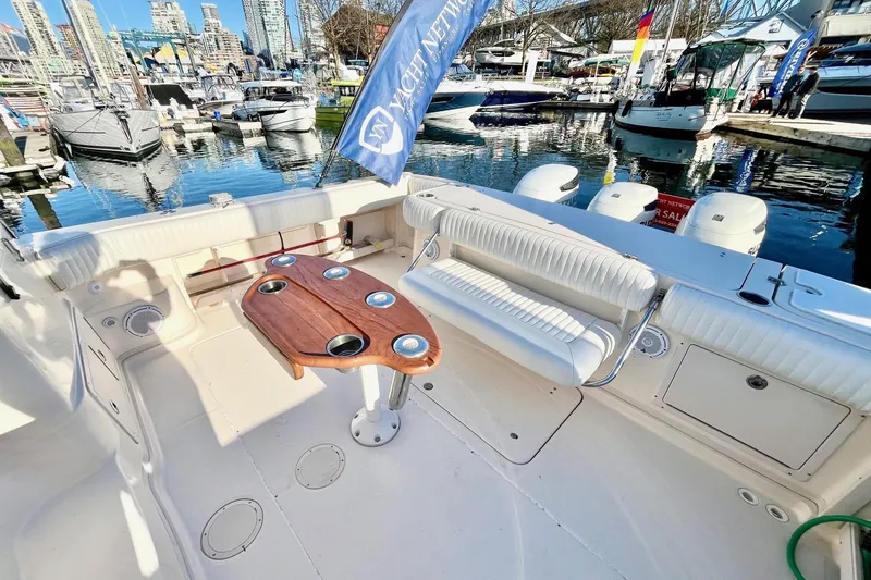  Yacht Photos Pics 2005 Grady-White Express 360 boat interior with seating and table at marina.