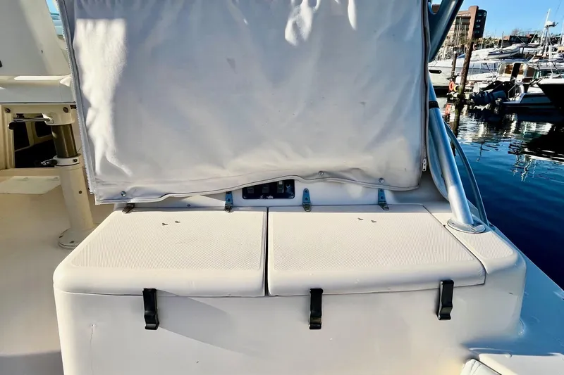  Yacht Photos Pics 2005 Grady-White Express 360 boat seating area with marina background.