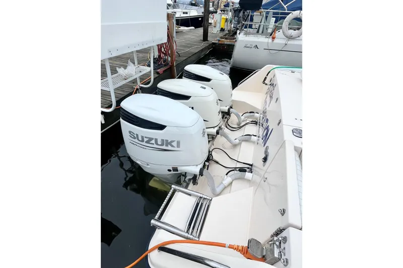  Yacht Photos Pics 2005 Grady-White Express 360 with Suzuki outboard motors docked at marina.