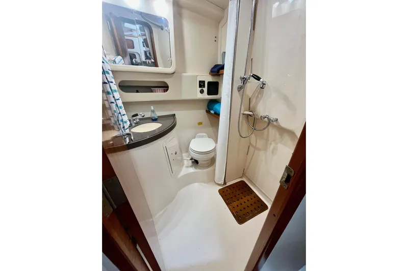  Yacht Photos Pics 2005 Grady-White Express 360 boat bathroom with shower, sink, and toilet.